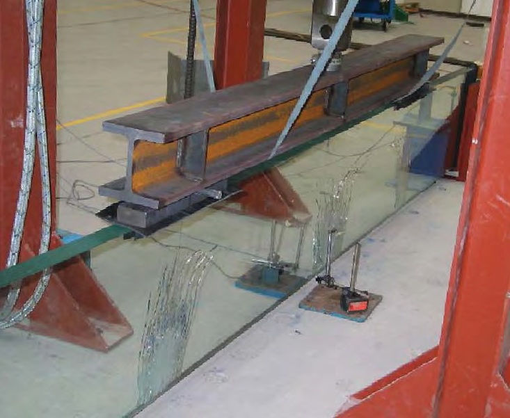 A new hybrid solution for structural glass reinforced beams